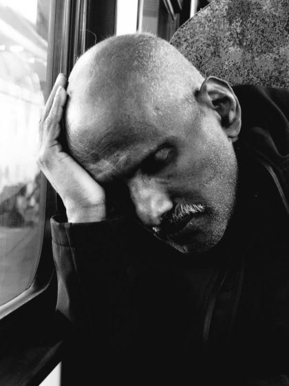 Tired Man in a Train